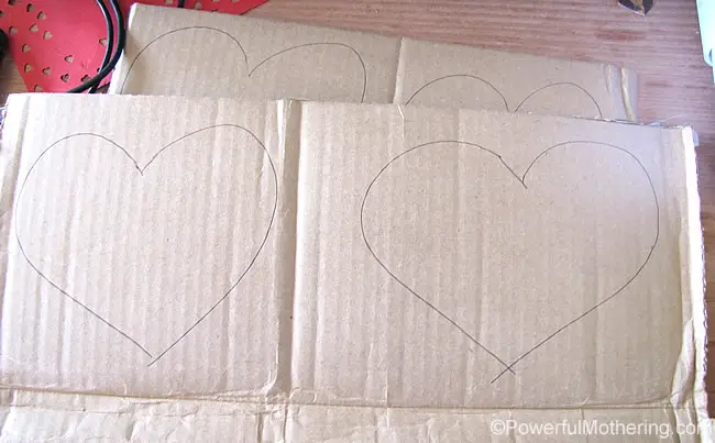 cut out hearts of cardboard