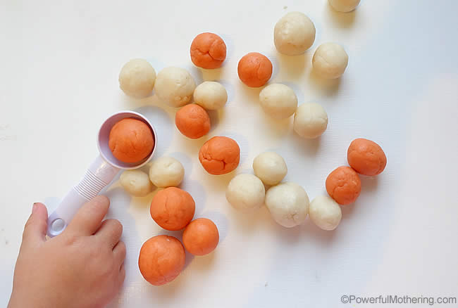 scooping peaches and cream playdough