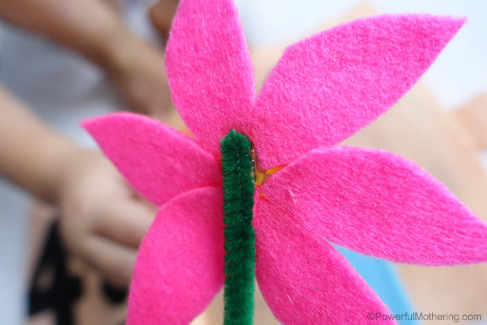attach pipecleaner to back of flower
