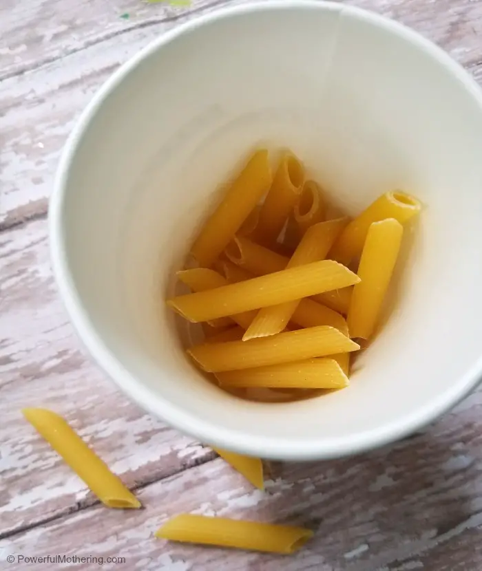 Making A Paper Cup Noisemaker Craft With Dry Pasta