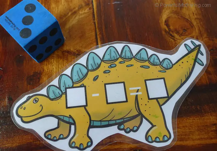 A Free Dinosaur Math Printable In A Busy Bag to help children practice both addition and subtraction in an easy and fun way.